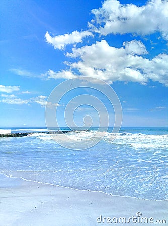 Sea â€‹â€‹surf sky sand sand beach Stock Photo